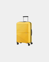 Lekka walizka 4-kołowa American Tourister Airconic 77 cm z nadrukiem - Żółty